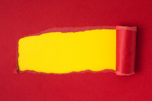 Red torn paper with yellow space for text or other content