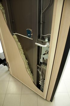 Exposed mechanism of armored door 