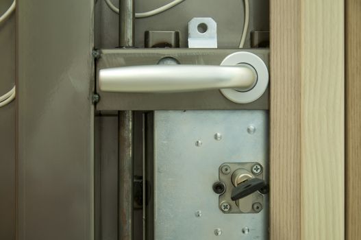 Exposed mechanism of armored door 