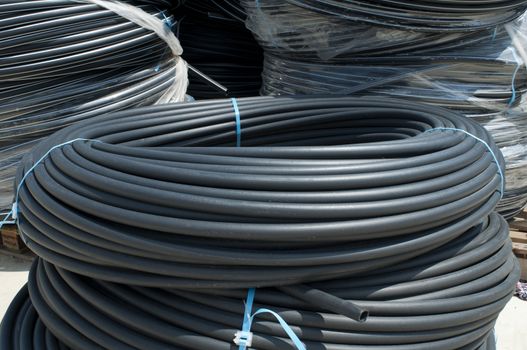 Coiled black PVC hoses. Polyethylene tubing