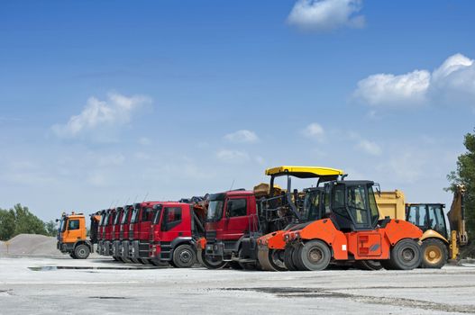 Trucks, rollers and machinery for asphalting. Horizontal image