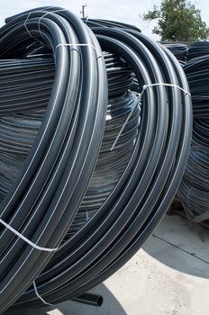 Coiled black PVC hoses. Polyethylene tubing