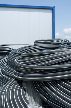 Coiled black PVC hoses. Polyethylene tubing