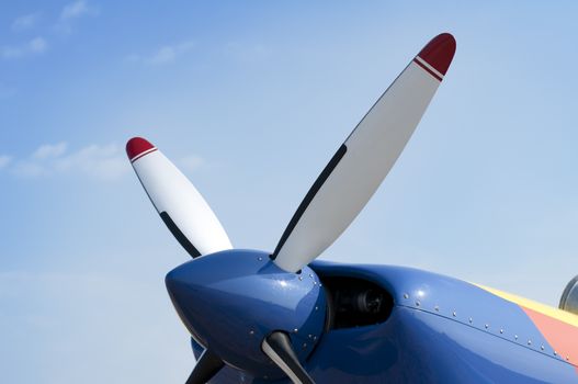 White plane propeller on blue sky background
