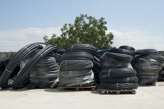 Coiled black PVC hoses. Polyethylene tubing