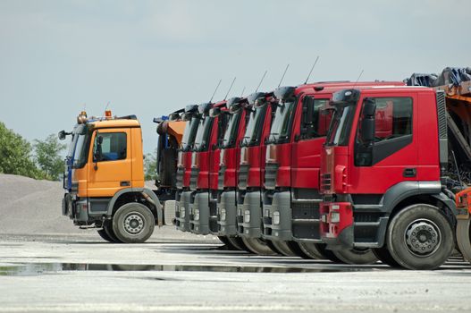 Trucks, rollers and machinery for asphalting. Horizontal image