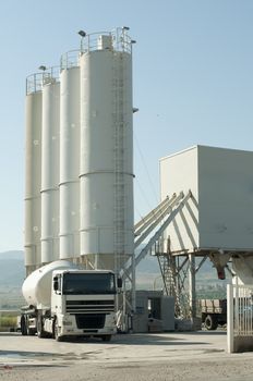 Cement factory and white truck loading cement