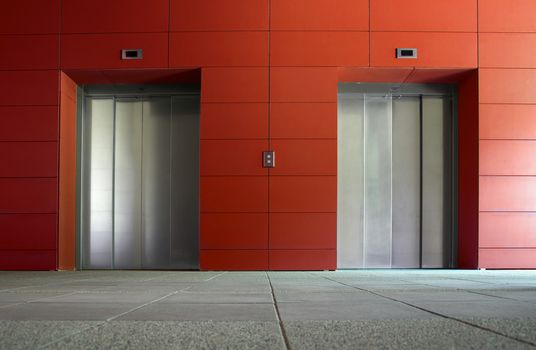 Two elevator doors in a luxurious building