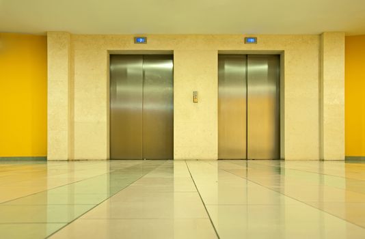 Two elevator doors in a luxurious building