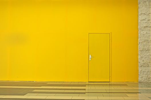 Yellow wall with a door. Horisontal background