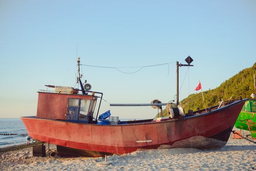 fisherman boats at sunrise time on the beach in summer