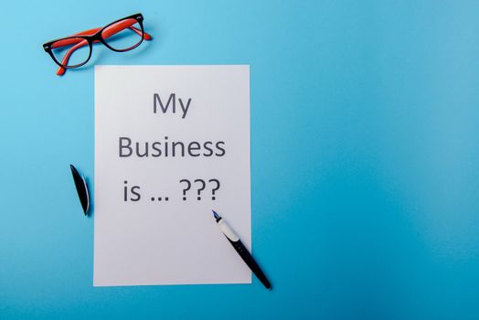 My business is word concept. Business word with business document paper on blue background. For business concept ideas background.