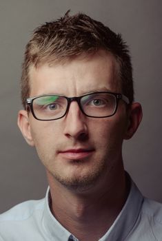 Portrait of a smart serious young man.