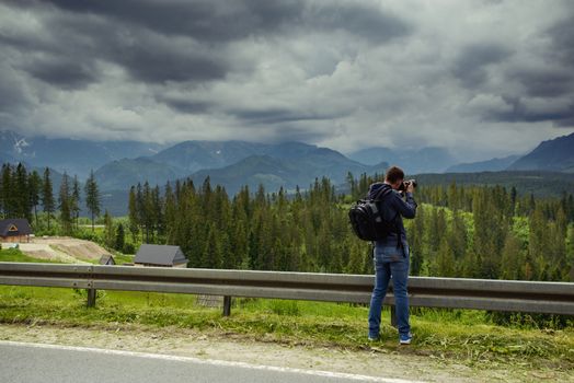 Nature photographer taking photos in the mountains.