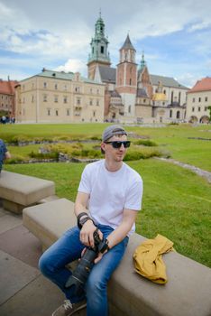 Manduring sightseeing old castle in Cracow, Wawel. Summer time