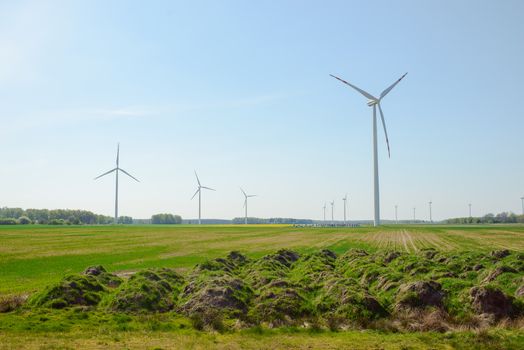 Bright blue sky moving and wind turbine.