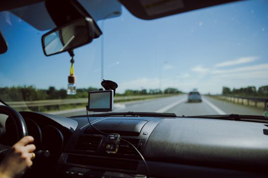 car and blue sky with blurred clouds.