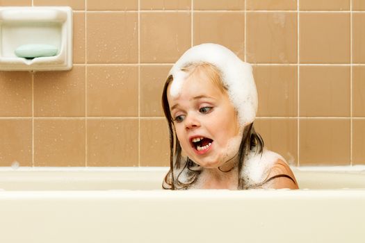 child having quite the imagination while playing in the bath