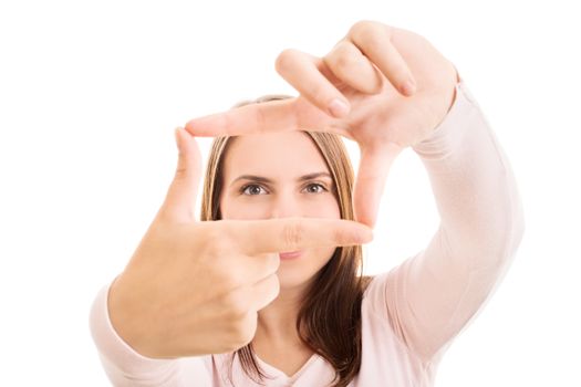Close up of a young attractive woman making a camera frame with her hands and fingers, isolated on white background. Copy Space. Creativity and photography concept.