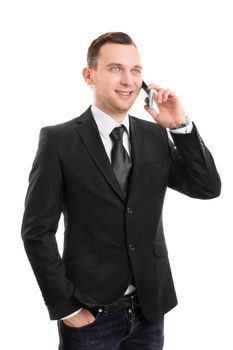 Portrait of a handsome young businessman talking on the mobile phone while standing, isolated on white background.