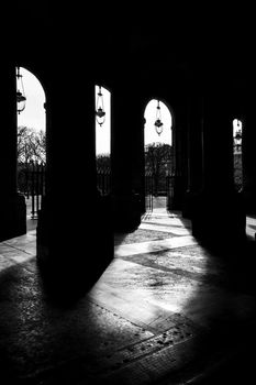 The Palais-Royal arcades in Paris, France. Black and white photography.