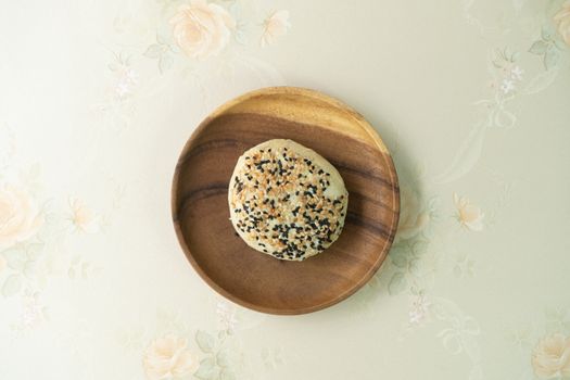 Chinese moon cake or pastry with sesame on top.