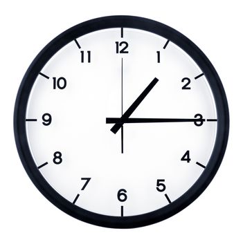 Classic analog clock pointing at one fifteen o'clock, isolated on white background