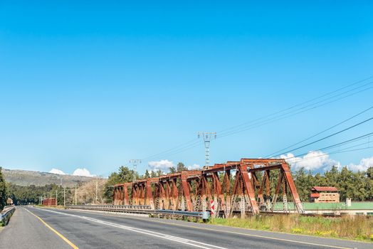 The road bridge and historic railway bridge over the Breede River at Wolseley in the Western Cape Province. The historic blockhouse is visible