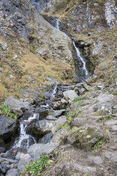 Polikarya waterfall in the Caucasus mountains near Sochi, Russia. Cloudy day 26 October 2019.