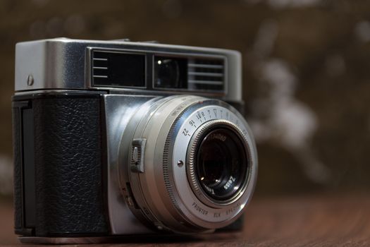 Antique Vintage Old Film Camera on organic background