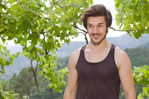 portrait of happy handsome young man, summer outdoors.