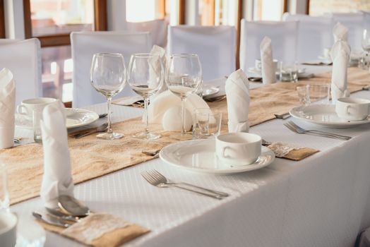 Wedding table set for fine dining or other catered event, center-piece