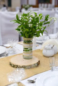 Wedding table set for fine dining or other catered event, center-piece