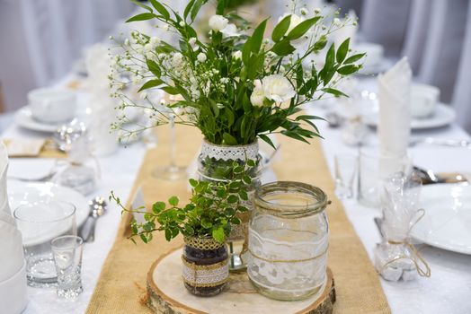 Wedding table set for fine dining or other catered event, center-piece