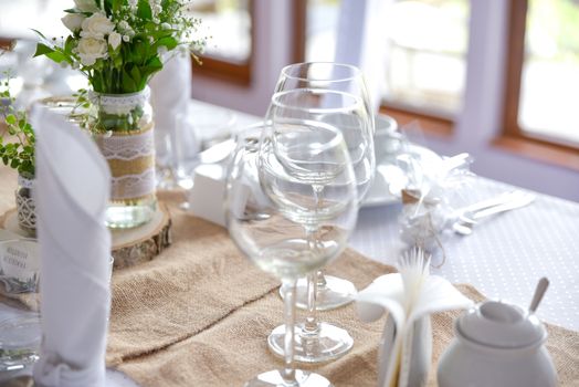 Wedding table set for fine dining or other catered event, center-piece