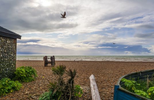 A small abandoned boat in Brighton's beach in autumn.