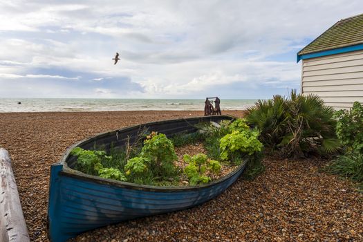 A small abandoned boat in Brighton's beach in autumn.