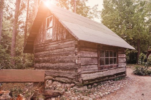 Abandoned old wooden house Cabin in the woods.  View of old weathered wooden