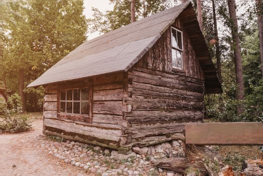 Abandoned old wooden house Cabin in the woods.  View of old weathered wooden