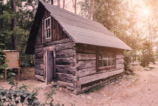 Abandoned old wooden house Cabin in the woods.  View of old weathered wooden