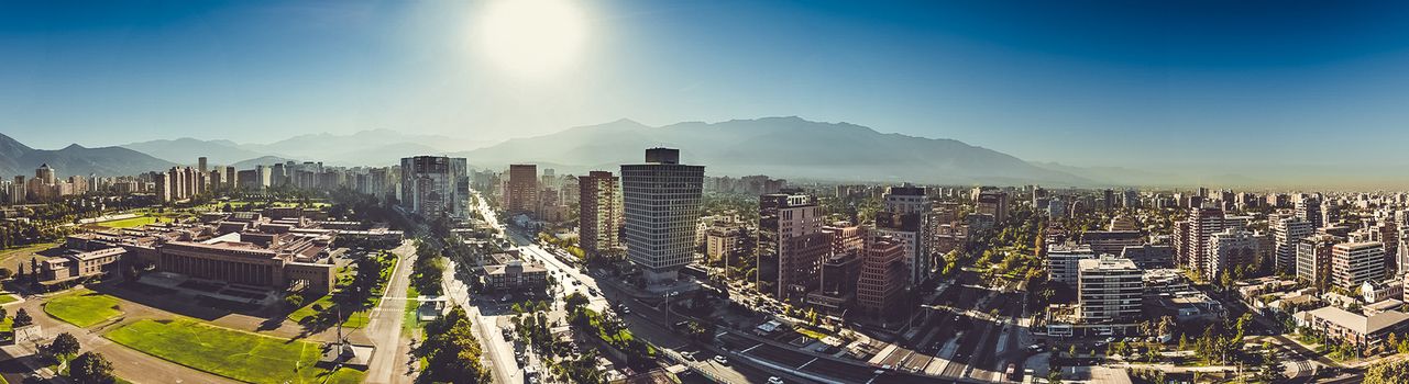Skyline of Santiago with multiple skyscrapers and the Andes mountain range at the back, Chile