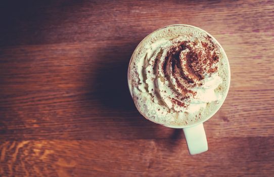 A Delicious Mug Of Creamy Pumpkin Spice Latte In A Coffee Shop