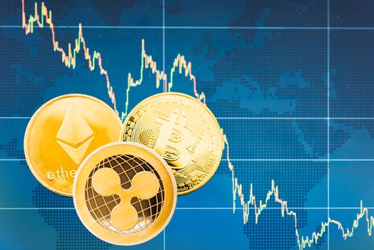 Business Bitcoin, ripple XRP and Ethereum coins currency finance money on graph chart background