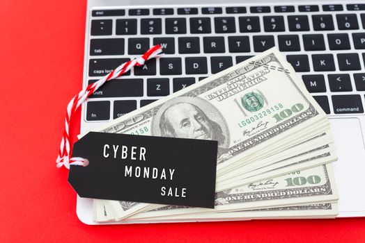 Online shopping CYBER MONDAY sale text on Black tag label on laptop computer, with copy space