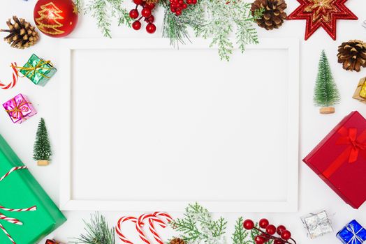 Christmas composition decorations, fir tree branches with Photo square frame on white background. Merry Christmas concept. Copy space for text
