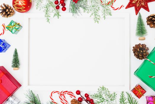 Christmas composition decorations, fir tree branches with Photo square frame on white background. Merry Christmas concept. Copy space for text
