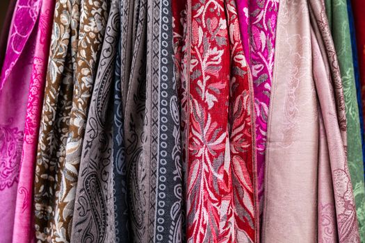 Different color and vintage style of fabric cloths gathering in vertical hanging