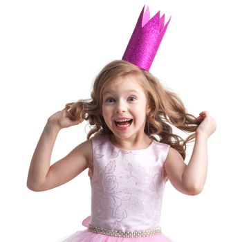 Little princess girl in pink dress and crown showing her curly blonde hair , studio isolated on white background