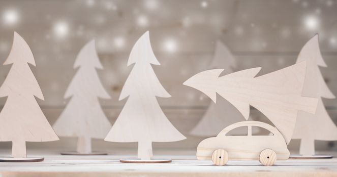 Christmas background. Toy handmade wooden car with christmas tree. Merry Christmas and Happy New Year background