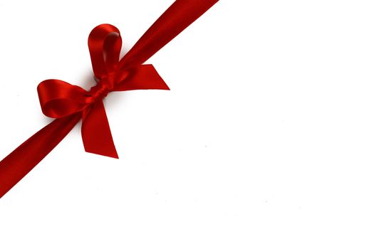 Elegant satin red ribbon bow isolated on white background